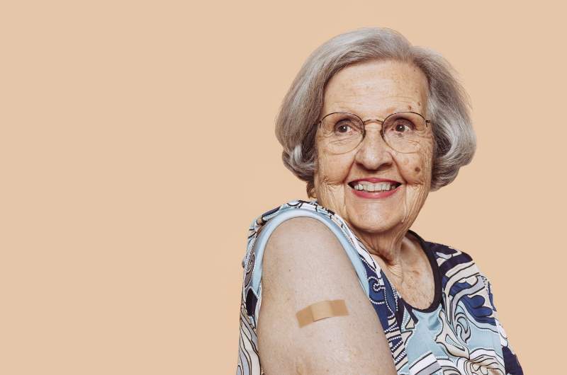 Older adult smiling after receiving Shingles - Shingrex - vaccine free at Narangba Station Medical Centre.