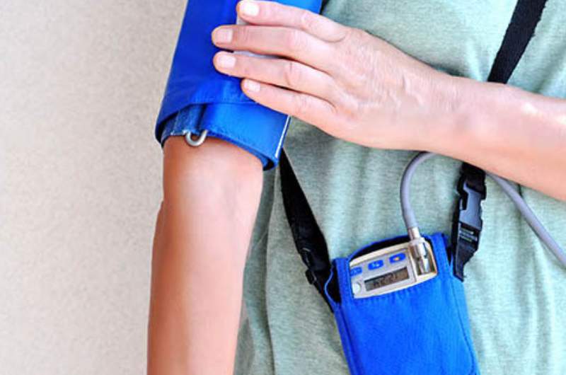 An individual wearing a 24 Hour Blood Pressure Monitor - available at Narangba Station Medical Centre.