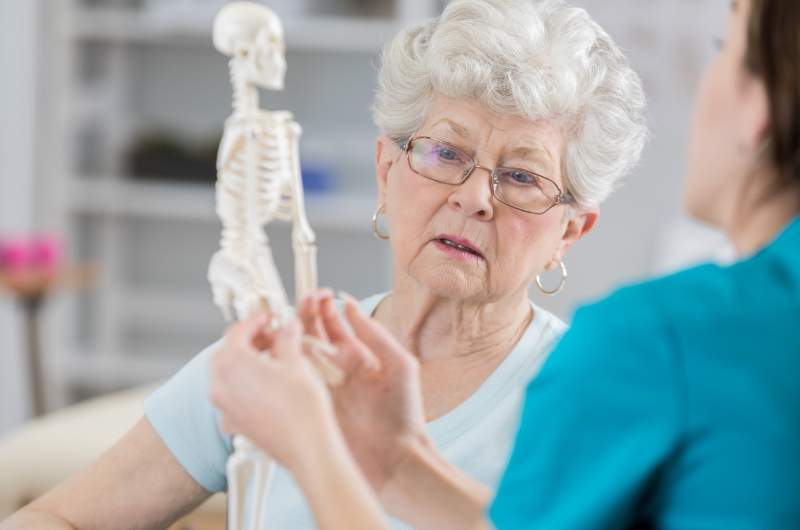 Doctor at Narangba Station Medical Centre consulting with Osteoporosis patient.