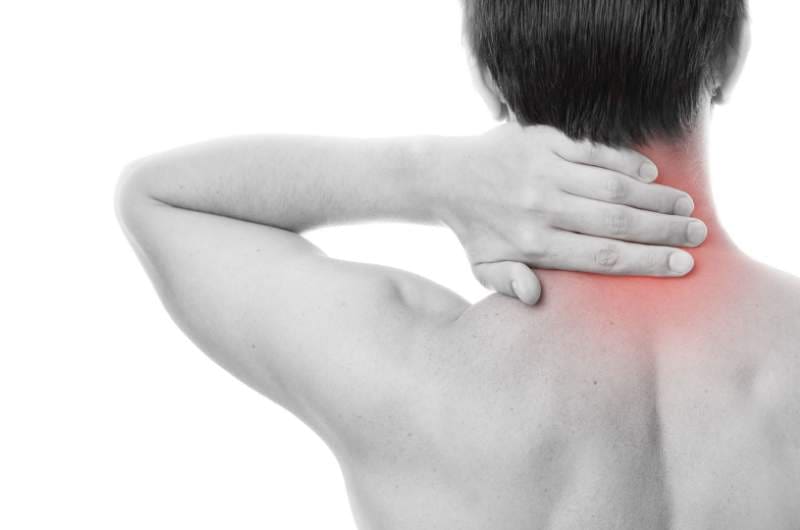 Fibromyalgia patient holding neck in pain | Fibromyalgia treatment available at Narangba Station Medical Centre.