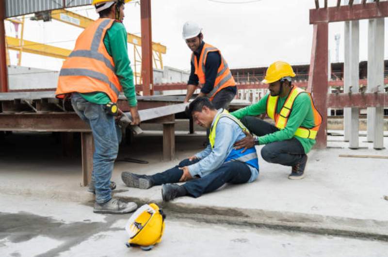 Injured employee at work supported by fellow workers | WorkCover Consultations available at Narangba Station Medical Centre.