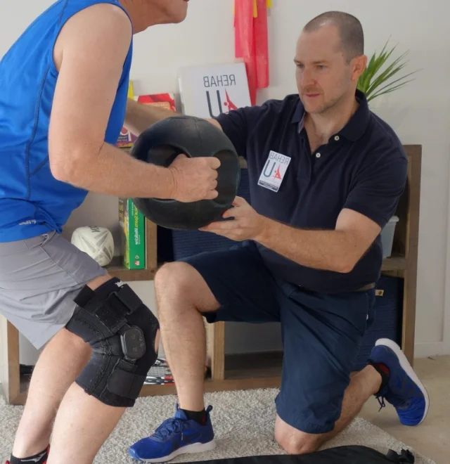 Narangba Station Medical Centre's physiotherapist, Stuart McClymont, working with a patient.