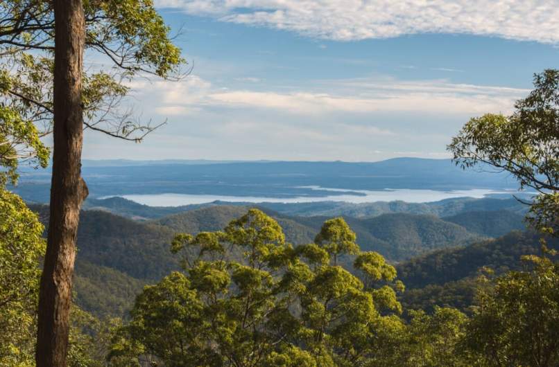 Landscape view from a mountain in Narangba, Brisbane, Queensland, of greenery and blue skies.