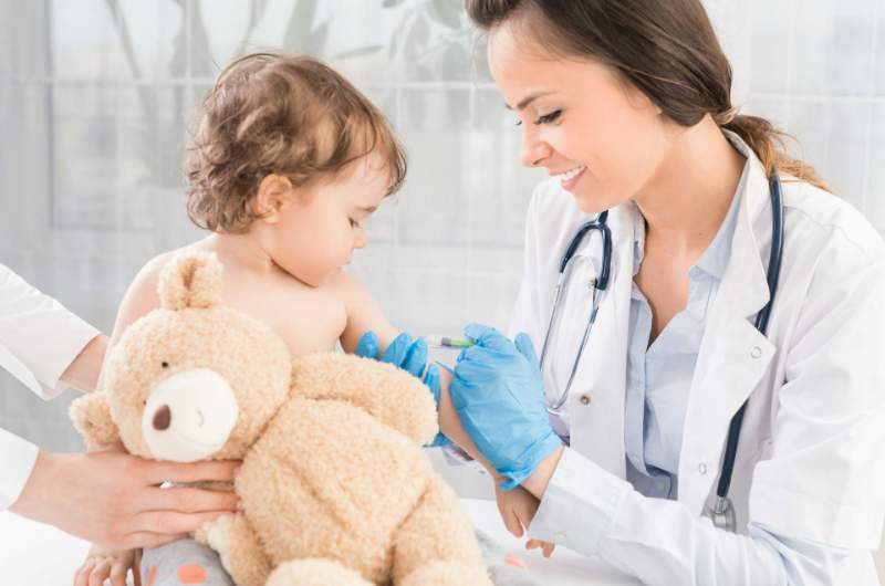 Child receives vaccination at Narangba Station Medical Centre.